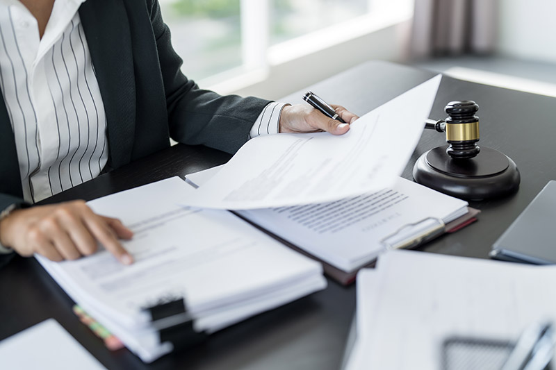 woman reading legal documents