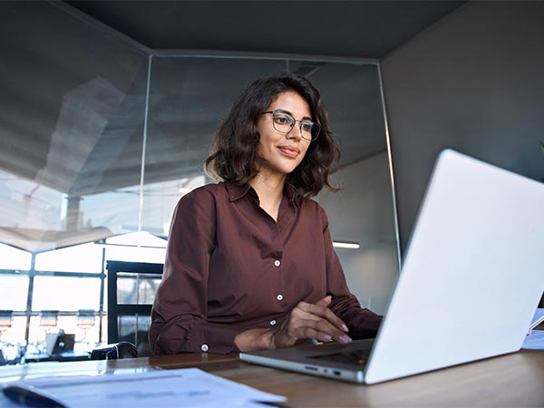 woman looking at laptop