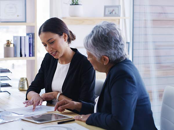 two people reviewing a document