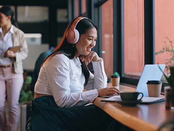 woman working remotely from cafe