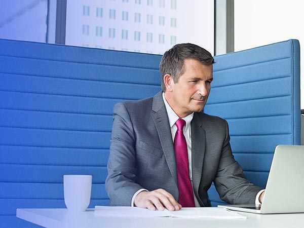 man in a booth in office